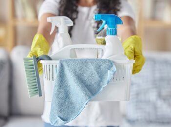 Cleaning, housework and hands of woman with basket, community service and safety from virus in a ho.